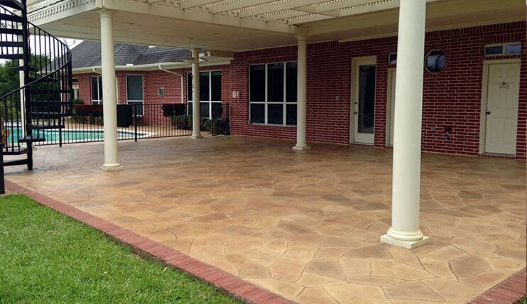 backyard-patio-deck-stamped-concrete-overlay