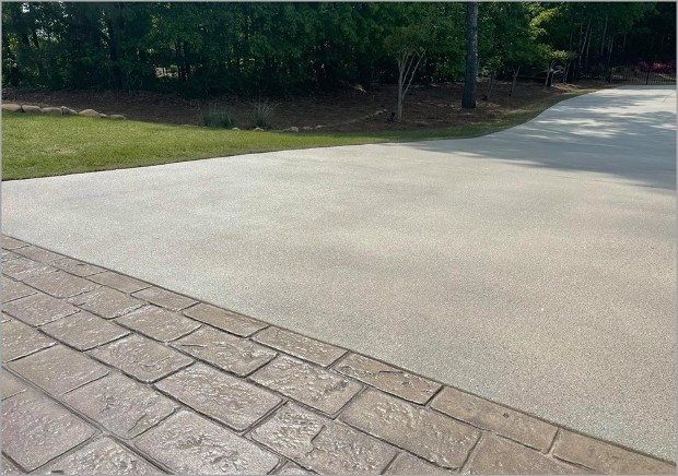 aggrekoat concrete decorative coating in tan with a stamped concrete brick apron to create a show stopping look
