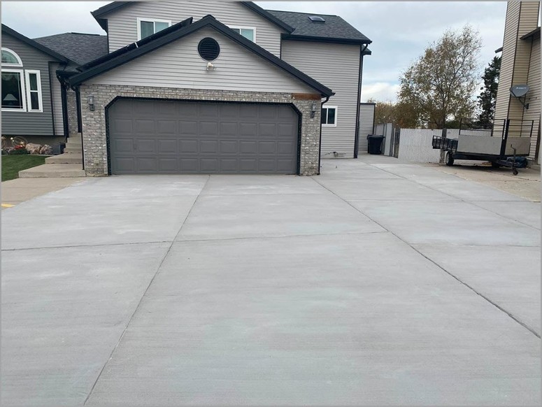 restorekoat finish in gray placed as a concrete overlay on a driveway 