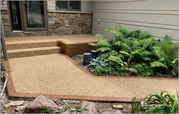 Walkway steps and front porch done with a brown Pebblekoat finish by Concrete Craft 