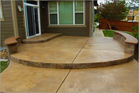 Outdoor decorative concrete patio with faux-stone