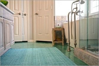 stained-bathroom-concrete-floor