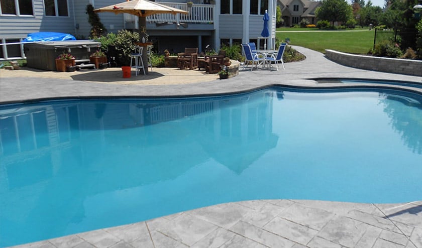 Stamped Ashlar Pattern Gray Concrete Pool Deck