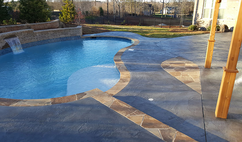 Decorative stamped resurfaced in roman texture slate pool deck