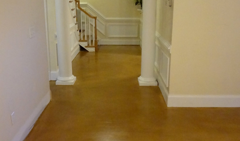 Stained interior hallway in light brown